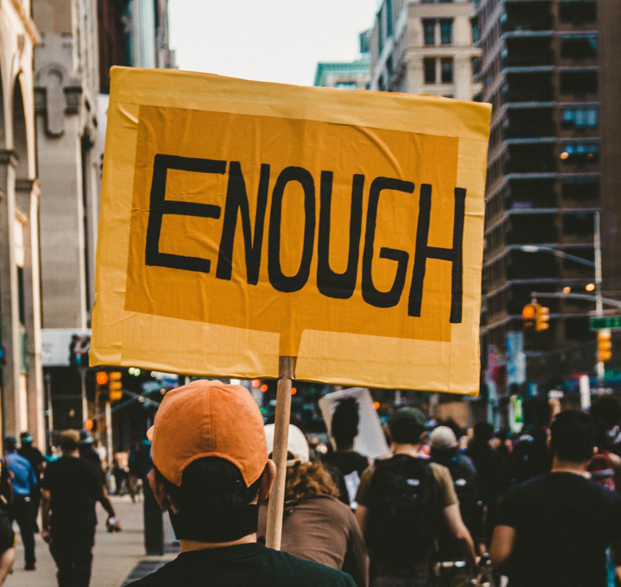 Protest with "enough" sign -- Organise