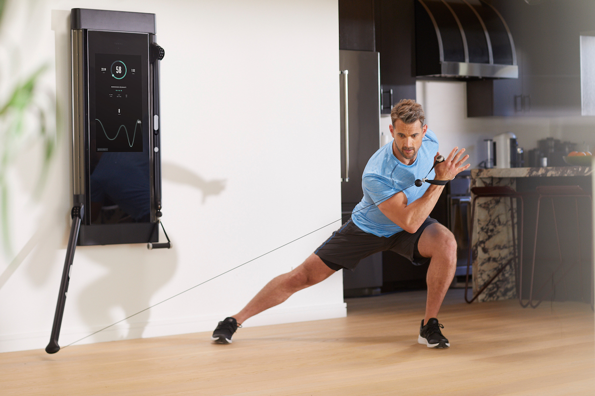 Man working out with Tonal AI-powered gym